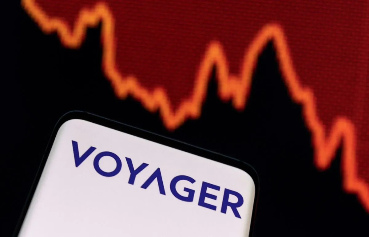 Voyager Digital logo and decreasing stock graph are seen in an illustration taken on July 7, 2022. (Dado Ruvic/Illustrations/Reuters)