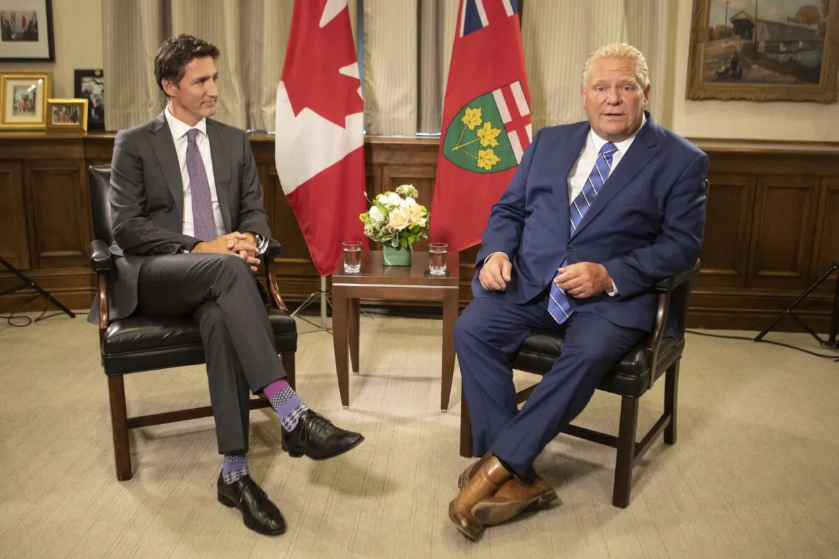 Prime Minister Justin Trudeau (L) meets Ontario Premier Doug Ford, at the Queens Park Legislature in Toronto on Aug. 30, 2022. (The Canadian Press/Chris Young)