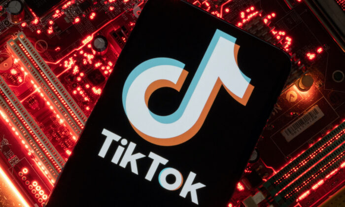 A smartphone with a displayed TikTok logo is placed on a computer motherboard in this illustration taken on Feb. 23, 2023. (Dado Ruvic/Reuters)