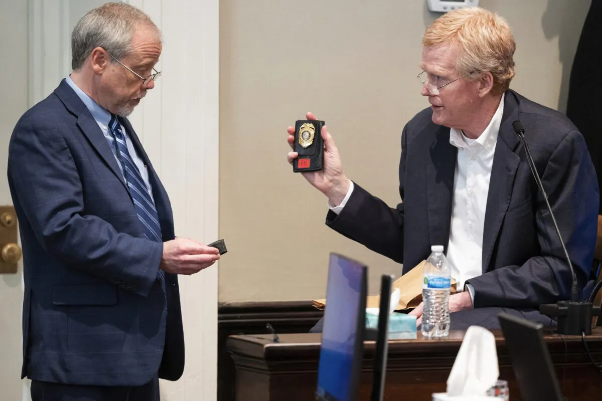 Prosecutor Creighton Waters (L) asks Alex Murdaugh if he recognizes two solicitors badges during Murdaugh's murder trial at the Colleton County Courthouse in Walterboro, S.C., on Feb. 23, 2023. (Joshua Boucher/The State via AP, Pool)