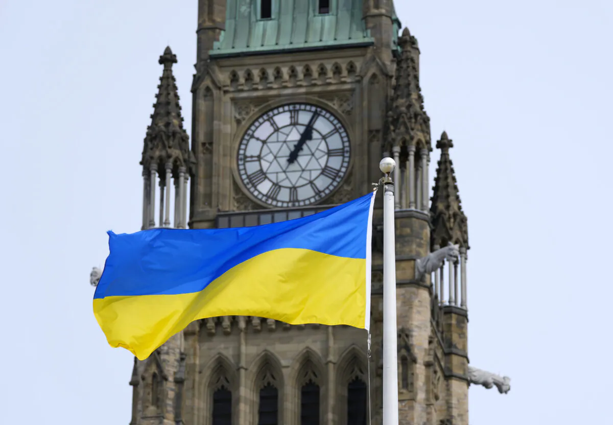 The flag of Ukraine is seen beside the Peace Tower, on the same day as Ukrainian President Volodymyr Zelenskyy’s address to Parliament in the House of Commons on Parliament Hill in Ottawa, on March 15, 2022. (The Canadian Press/Justin Tang)
