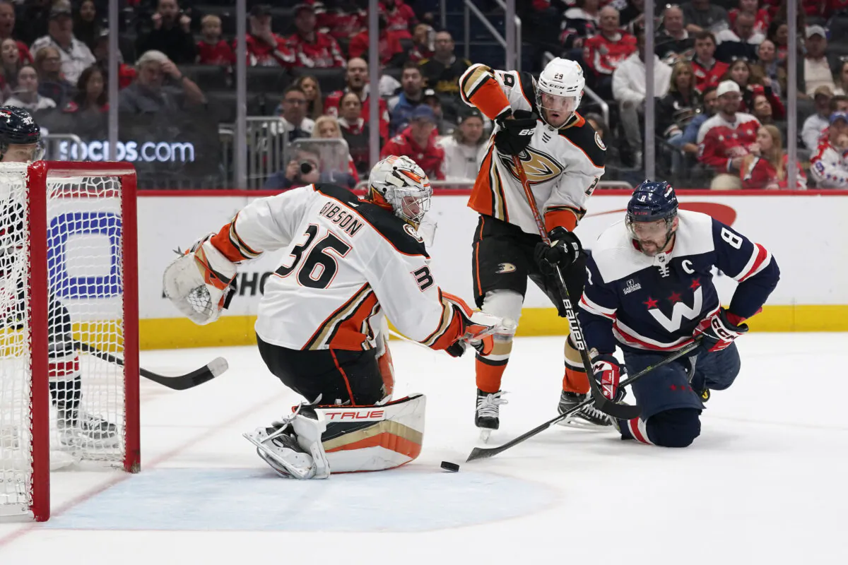 Washington Capitals left wing Alex Ovechkin, right, attempts but is unable to score a goal past Anaheim Ducks goaltender John Gibson, left, and defenseman Dmitry Kulikov in the third period of an NHL hockey game, in Washington, Feb. 23, 2023. (Patrick Semansky/AP Photo)