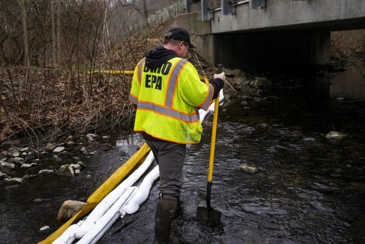 Ron Fodo, Ohio EPA Emergency Response, looks for signs of fish and also agitates the water in Leslie Run creek to check for chemicals that have settled at the bottom following the train derailment prompting health concerns in East Palestine, Ohio, on Feb. 20, 2023. (Michael Swensen/Getty Images)