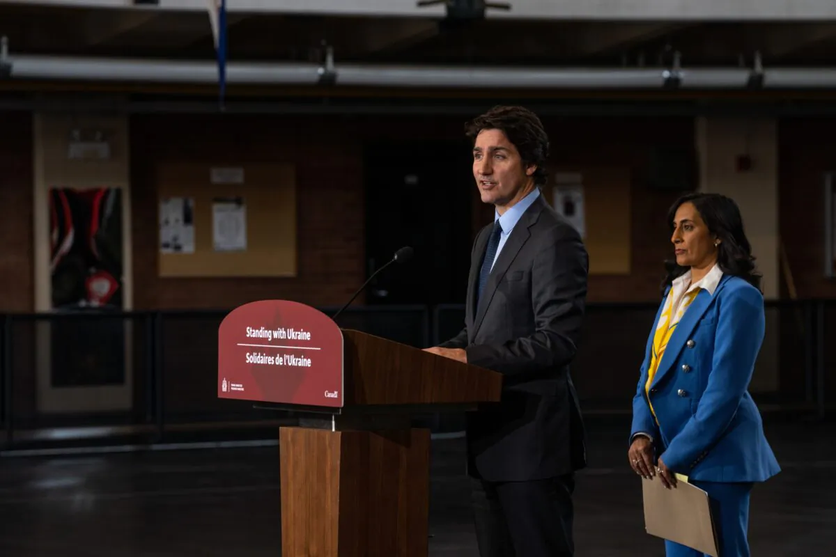 Prime Minister Justin Trudeau and Defence Minister Anita Anand hold a press conference in Toronto on Feb. 24, 2023. (Katherine KY Cheng/Getty Images)