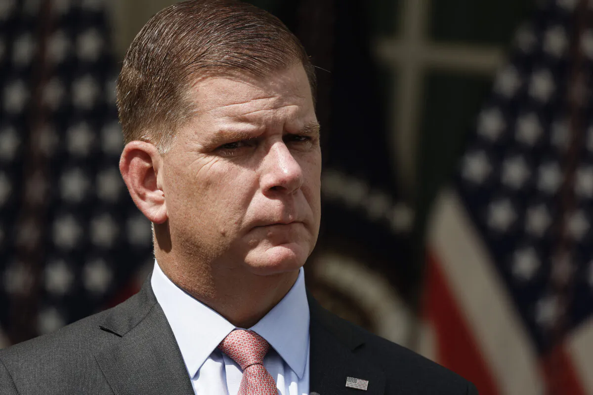 Labor Secretary Marty Walsh listens as U.S. President Joe Biden speaks during an event in the Rose Garden of the White House  in Washington on September 15, 2022. (Anna Moneymaker/Getty Images)
