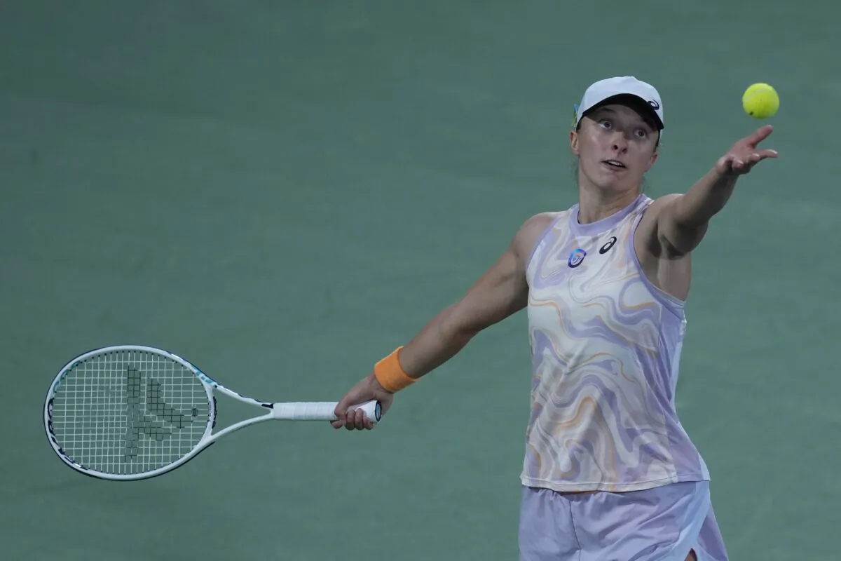 Poland's Iga Swiatek serves to Coco Gauff from the United States during their semifinal match of the Dubai Duty Free Tennis Championships in Dubai, United Arab Emirates, on Feb 23, 2023. (Kamran Jebreili/AP Photo)