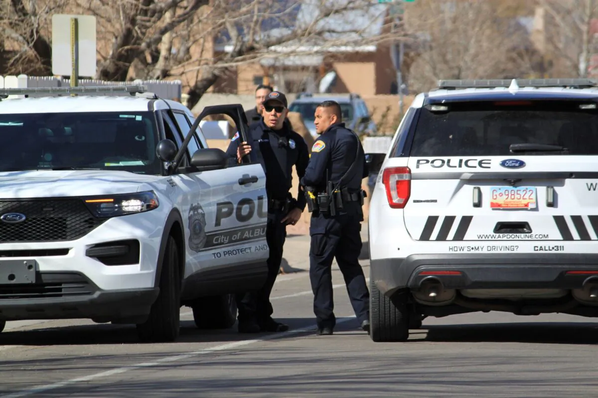 Police are seen outside a home of a fatal shooting in Albuquerque, N.M., on Feb. 23, 2023. (Susan Montoya Bryan/AP Photo)