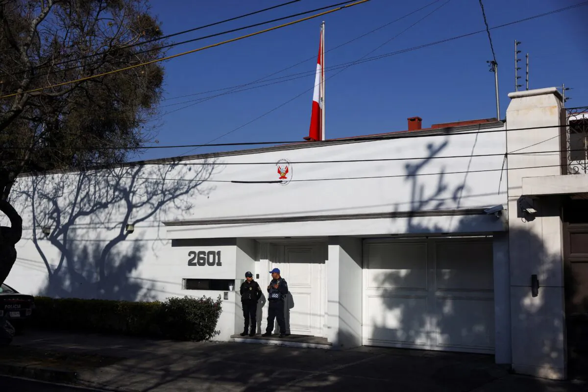 Police officers stand outside the Embassy of Peru in Mexico City, a day after Peru's President Dina Boluarte announced the return of the country's ambassador to Mexico, in Mexico City, Mexico, on Feb. 25, 2023. (Luis Cortes/Reuters, File Photo)