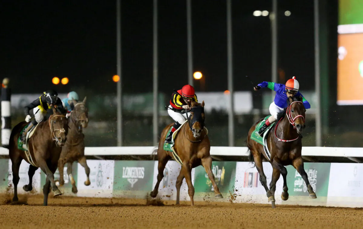 Yutaka Yoshida on Panthalassa in action with Christhope Lemaire on Georglyph and Joao Moreira on Cafe Pharoah during the Saudi Cup in Riyadh, Saudi Arabia, on Feb. 25, 2023. (Ahmed Yosri/Reuters)