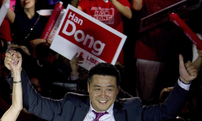 Han Dong, now a federal Liberal MP, celebrating with supporters as a provincial Liberal candidate in the Toronto area on May 22, 2014.  (Nathan Denette/The Canadian Press)