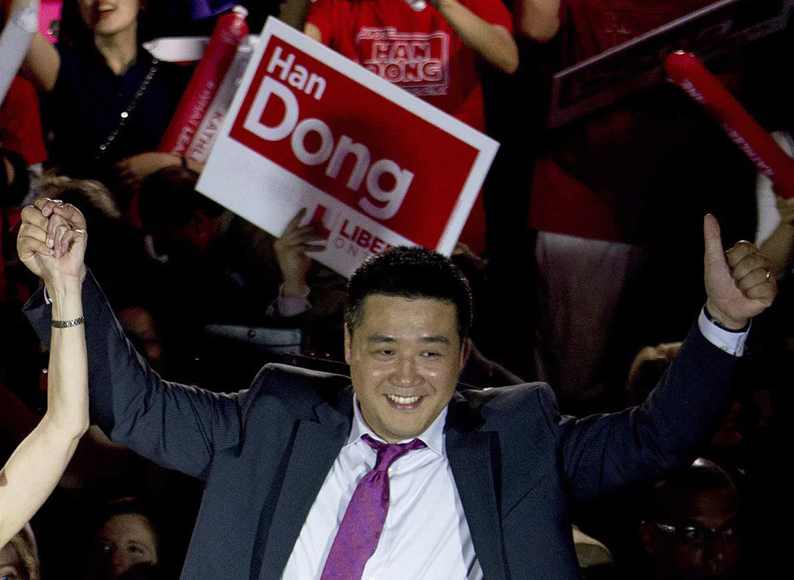 Han Dong, now a federal MP, celebrates at a rally during his campaign as a provincial Liberal candidate in a Toronto-area riding, in Toronto on May 22, 2014. (The Canadian Press/Nathan Denette)