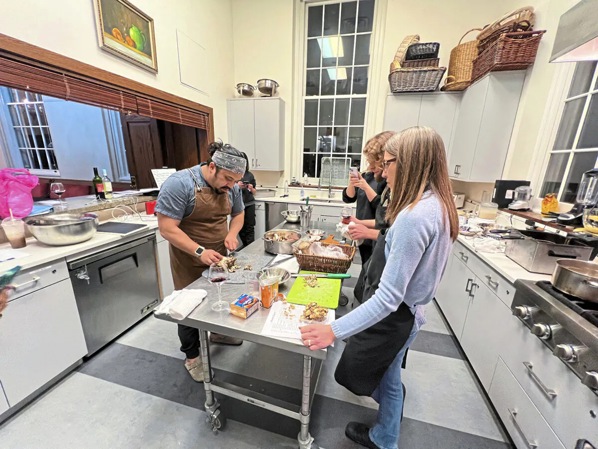 Chef Andrew Alvarez shows students how to chop shiitake mushrooms during a recent cooking class focused on Guamian and Korean foods at Sweetwater Center for the Arts in Sewickley. (Gretchen McKay/Pittsburgh Post-Gazette/TNS)
