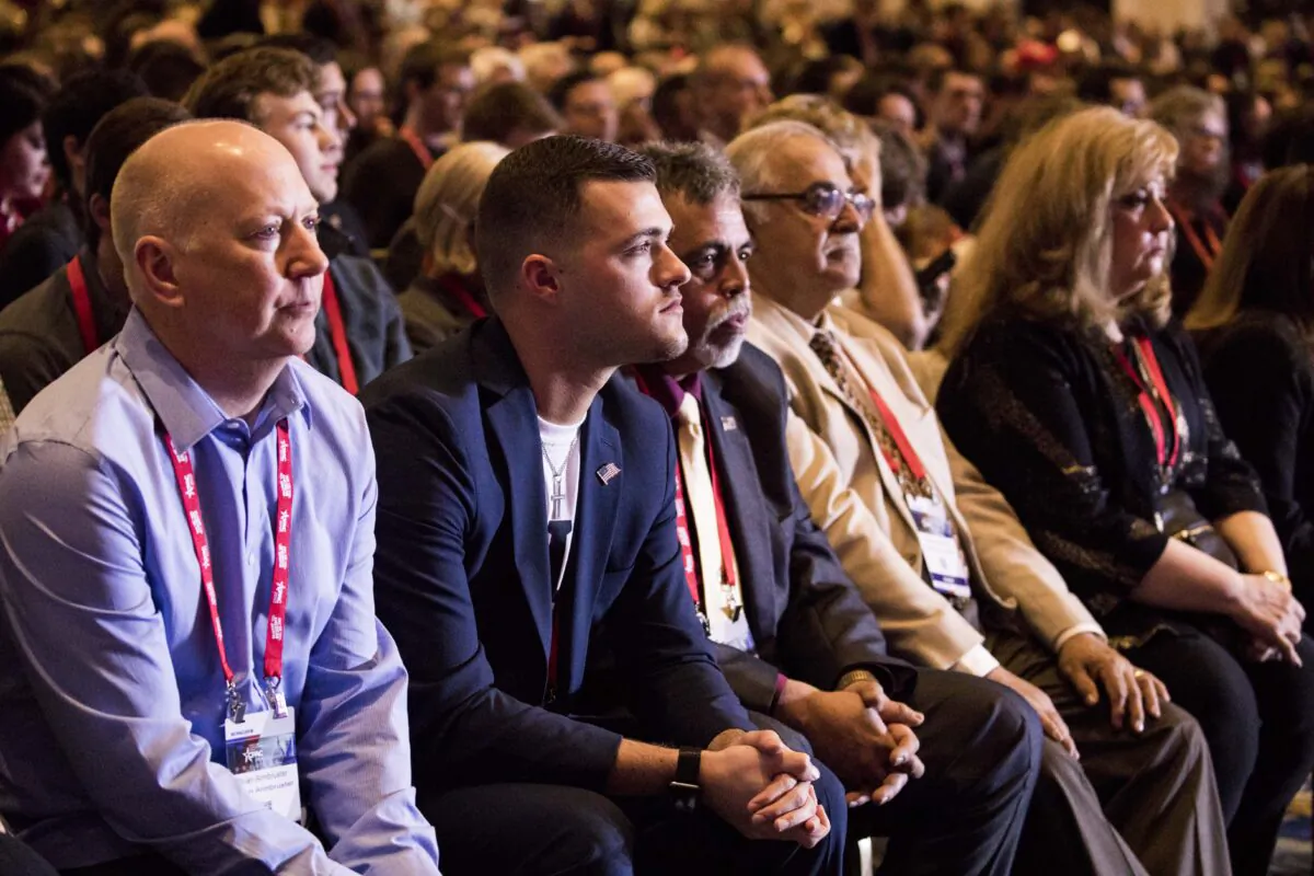 Audience members listen to President Donald Trump speak at the CPAC 2018 in National Harbor, Md., on Feb. 23, 2018. (Samira Bouaou/The Epoch Times)
