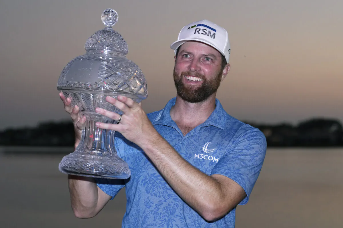 Chris Kirk holds the trophy after winning the Honda Classic golf tournament in a playoff against Eric Cole, in Palm Beach Gardens, Fla., on Feb. 26, 2023. (Lynne Sladky/AP Photo)