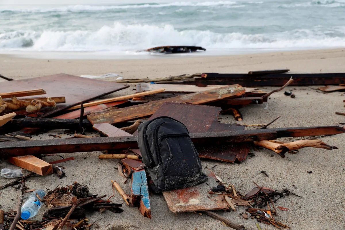 The wreckage of a shipwreck in southern Italy which has left dozens of migrants dead after the boat in which they were traveling smashed onto the rocks, in Cutro, Italy, on Feb. 27, 2023. (Remo Casilli/Reuters)