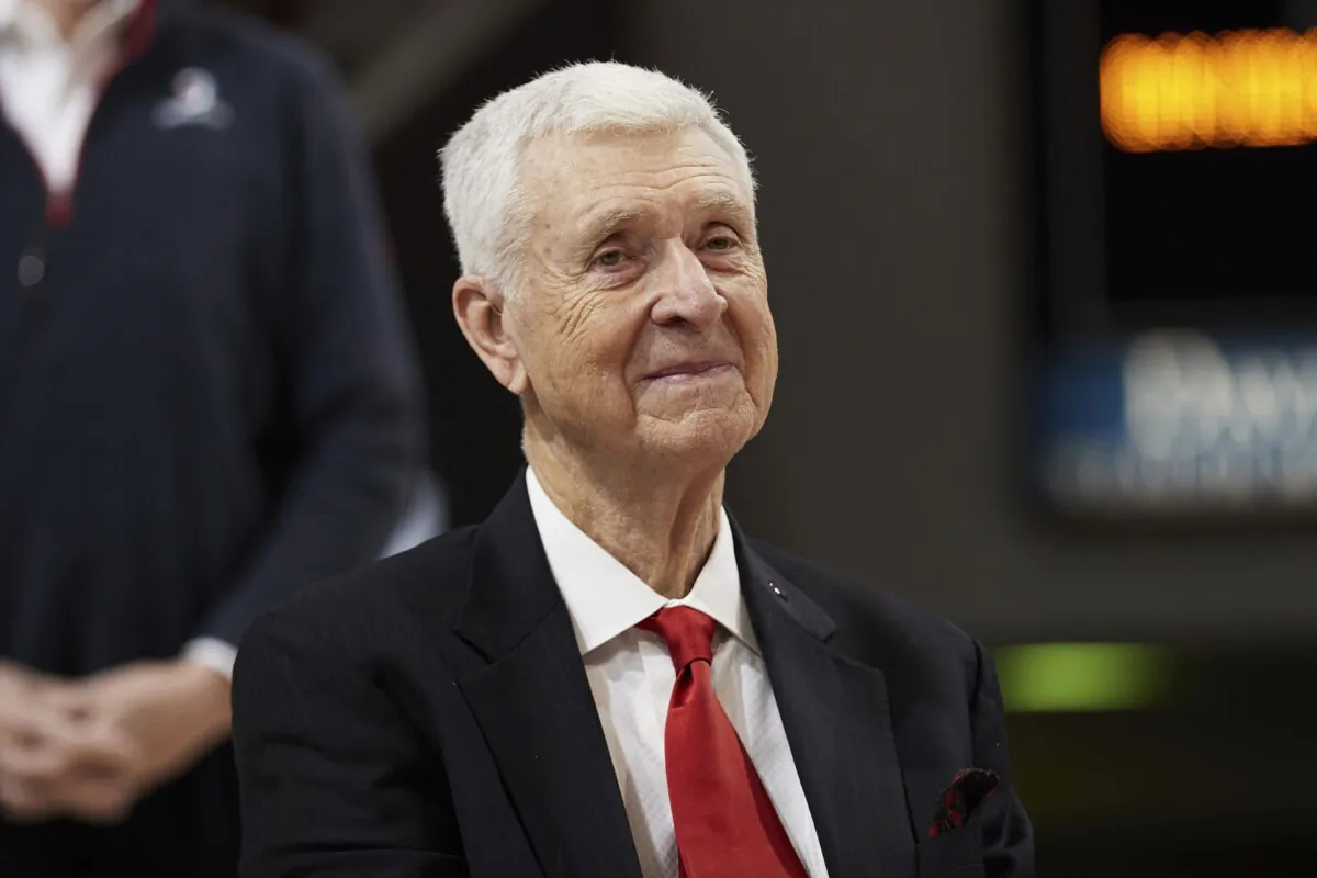 Former Davidson basketball player, coach, and Athletic Director, and former Virginia coach, Terry Holland, smiles during a ceremony to retire his jersey number 42 following an NCAA college basketball game between LaSalle and Davidson in Davidson, N.C., on Jan. 30, 2022. (Brian Westerholt/AP Photo)