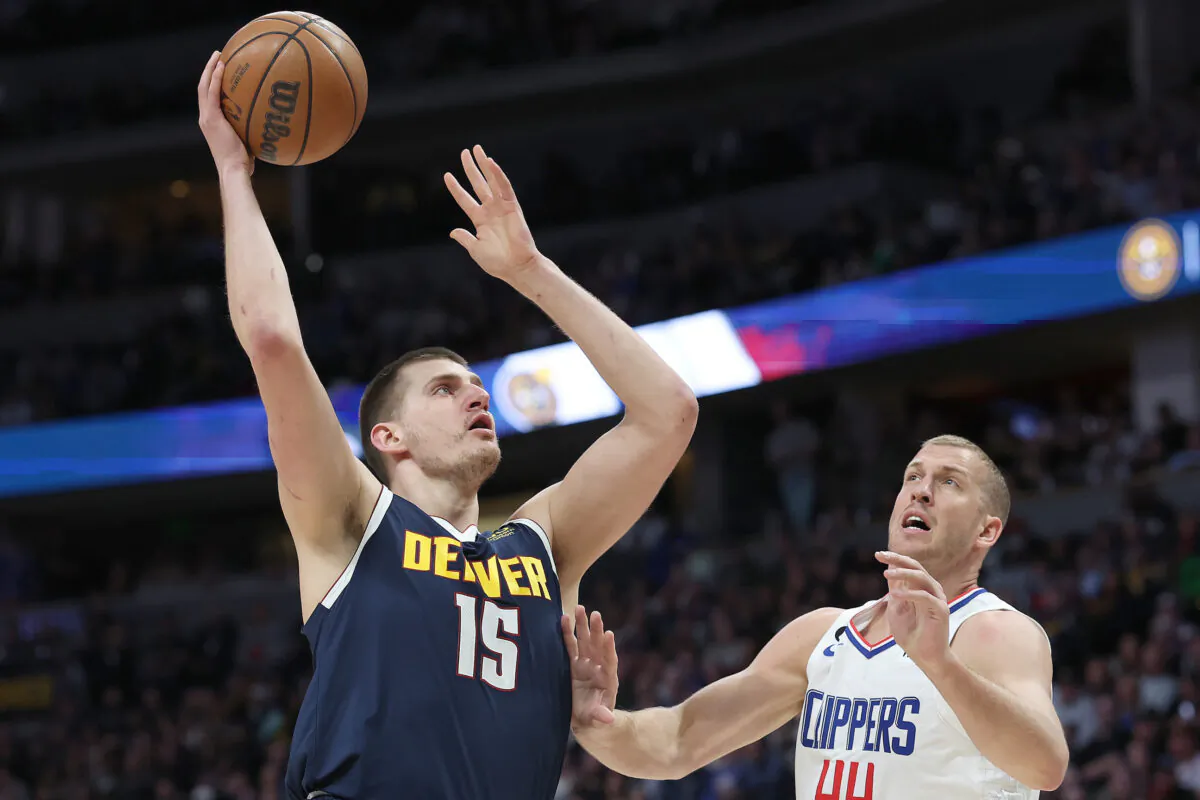 Nikola Jokic (15) of the Denver Nuggets puts up a shot over Mason Plumlee (44) of the Los Angeles Clippers in the first quarter at Ball Arena in Denver on Feb. 26, 2023. (Matthew Stockman/Getty Images)