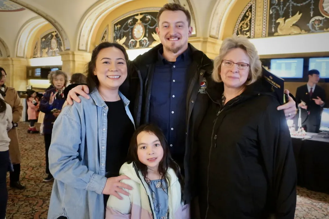 Jake Riley and Bao Lee and their mother and daughter at the Shen Yun Performing Arts performance at Orpheum Theatre, on Feb. 26, 2023. (Stacey Tang/The Epoch Times)