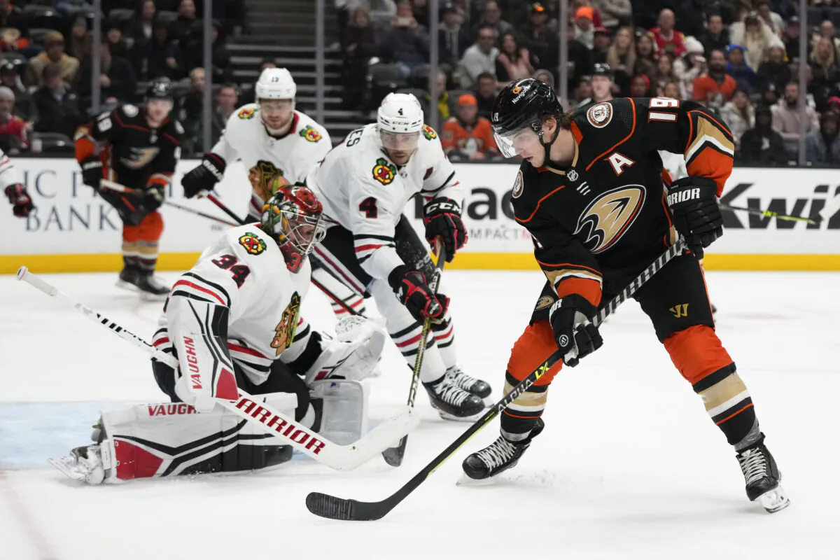 Anaheim Ducks' Troy Terry (19) sets up to shoot against Chicago Blackhawks goaltender Petr Mrazek (34) during the third period of an NHL hockey game in Anaheim, Calif., on Feb. 27, 2023. (Jae C. Hong/AP Photo)