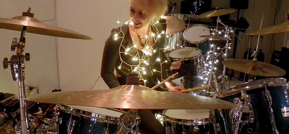 woman drumming with christmas lights in COUNT ME IN