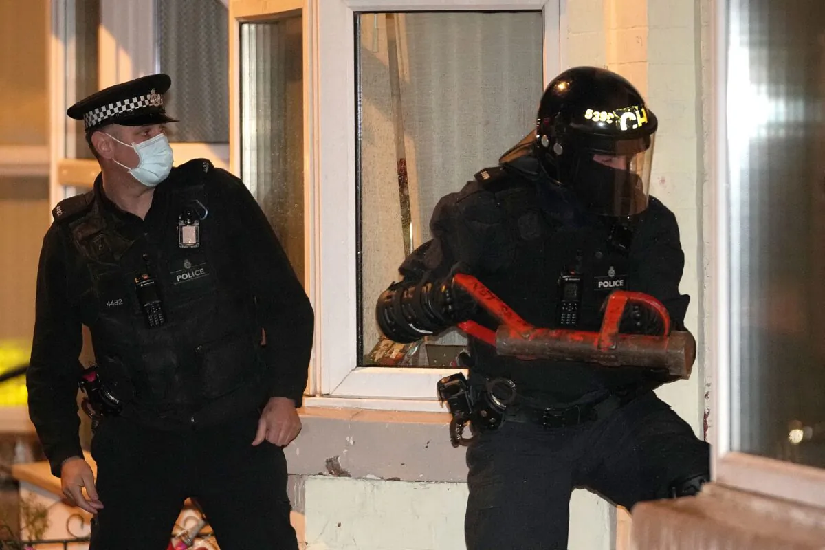 Merseyside Police perform an early morning raid on a home in Liverpool as part of Operation Toxic to infiltrate county lines drug dealing, on Dec. 6, 2021. (Christopher Furlong/POOL/AFP via Getty Images)