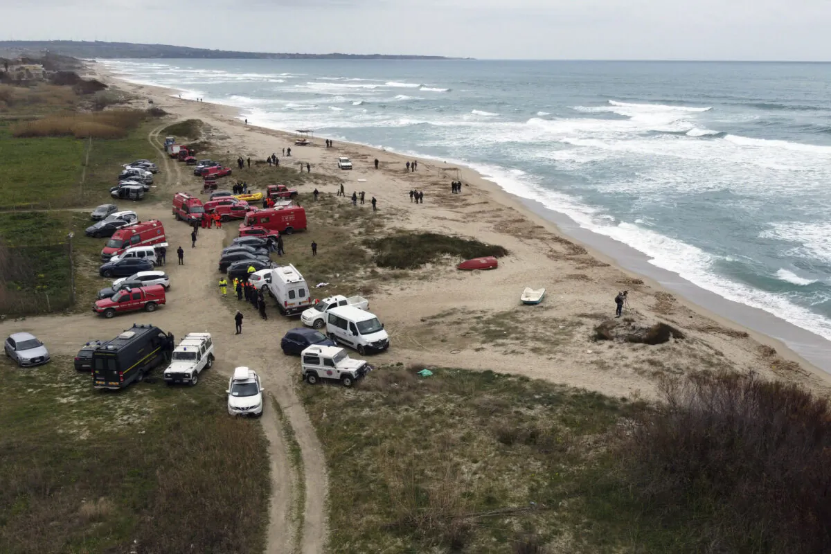 Firefighters search among debris washed ashore by sea at a beach near Cutro, southern Italy, on Feb. 27, 2023. (Giovanni Isolino/LaPresse via AP)