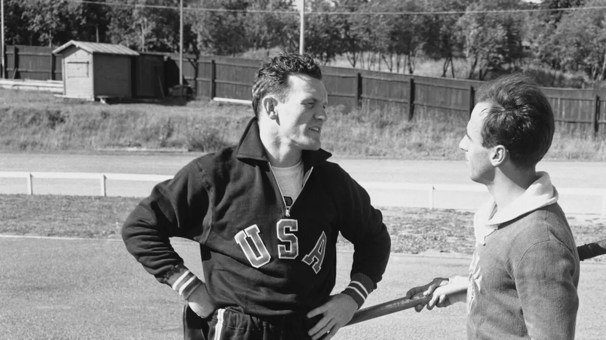American pole vaulter Bob Richards, left, talks with Brazilian pole vaulter Helcio Buck-Silva during a break in a training session in Helsinki, July 11, 1952. Bob Richards, a two-time Olympic pole vault gold medalist who also became an ordained minister, died Sunday, Feb. 26, 2023. .(AP Photo/Olympic World Photo, Pool, File)

