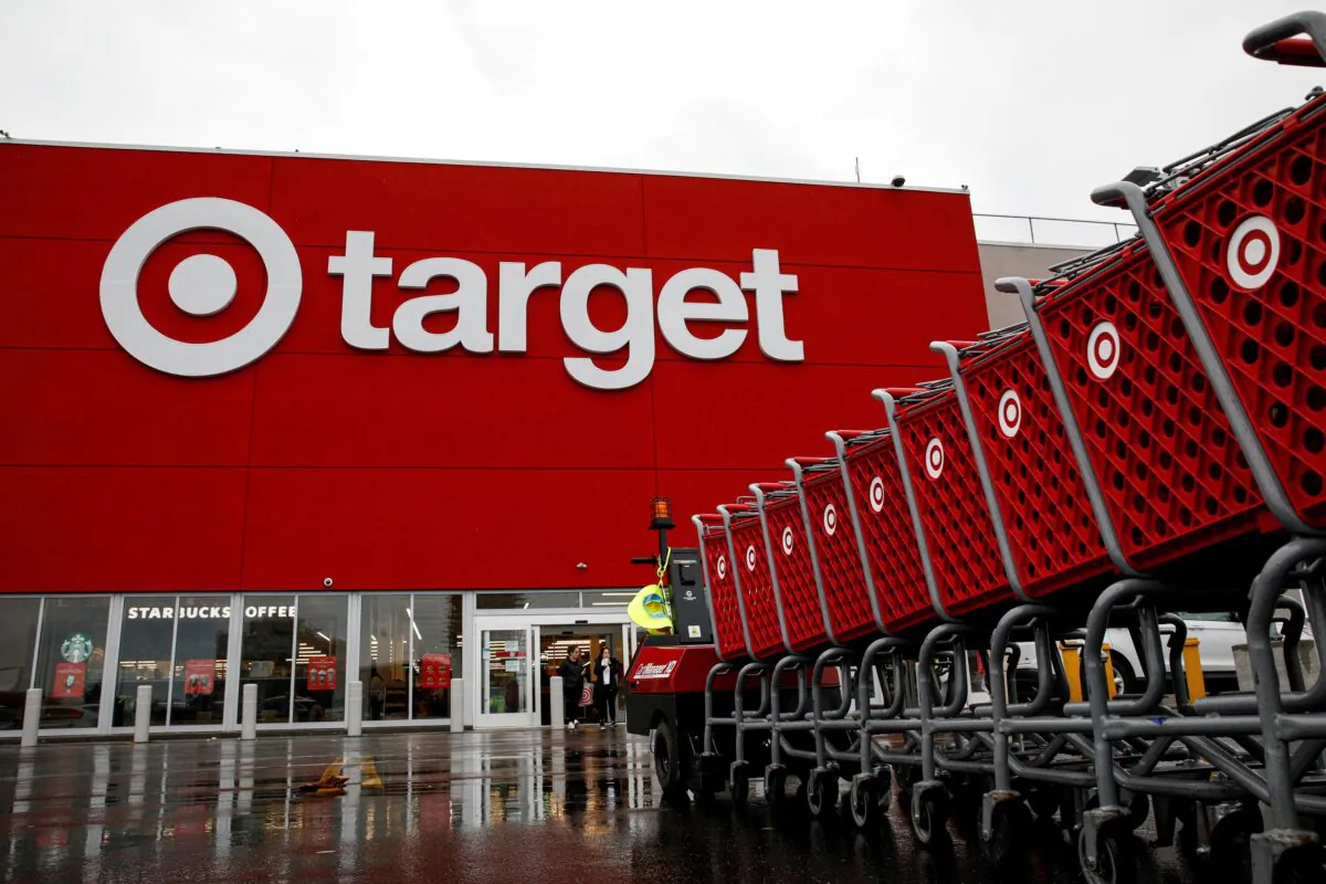 Shoping carts are wheeled outside a Target Store during Black Friday sales in New York City, on Nov. 26, 2021. (Brendan McDermid/Reuters)