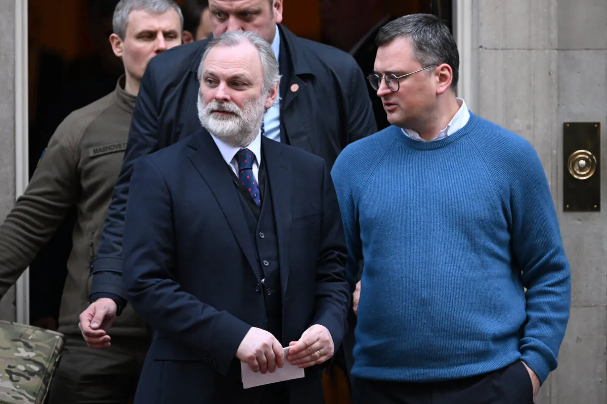 Sir Tim Barrow (L), national security adviser for the UK, leaves 10 Downing Street following a bilateral meeting with Ukrainian President Volodymyr Zelenskyy, in London, on Feb. 8, 2023. (Leon Neal/Getty Images)
