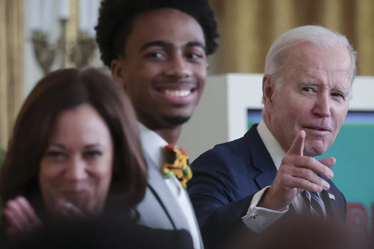 President Joe Biden speaks during an event in the East Room of the White House marking Black History Month in Washington, D.C., on Feb. 27, 2023. Also pictured is U.S. Vice President Kamala Harris (left) and DuWayne Portis Jr., High School Senior and Youth Leader at Chicago Youth Service Corps. (Win McNamee/Getty Images)