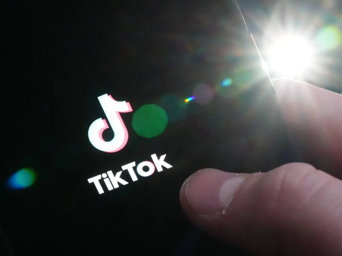 The TikTok startup page is displayed on an iPhone in Ottawa on Feb. 27, 2023. (The Canadian Press/Sean Kilpatrick)
