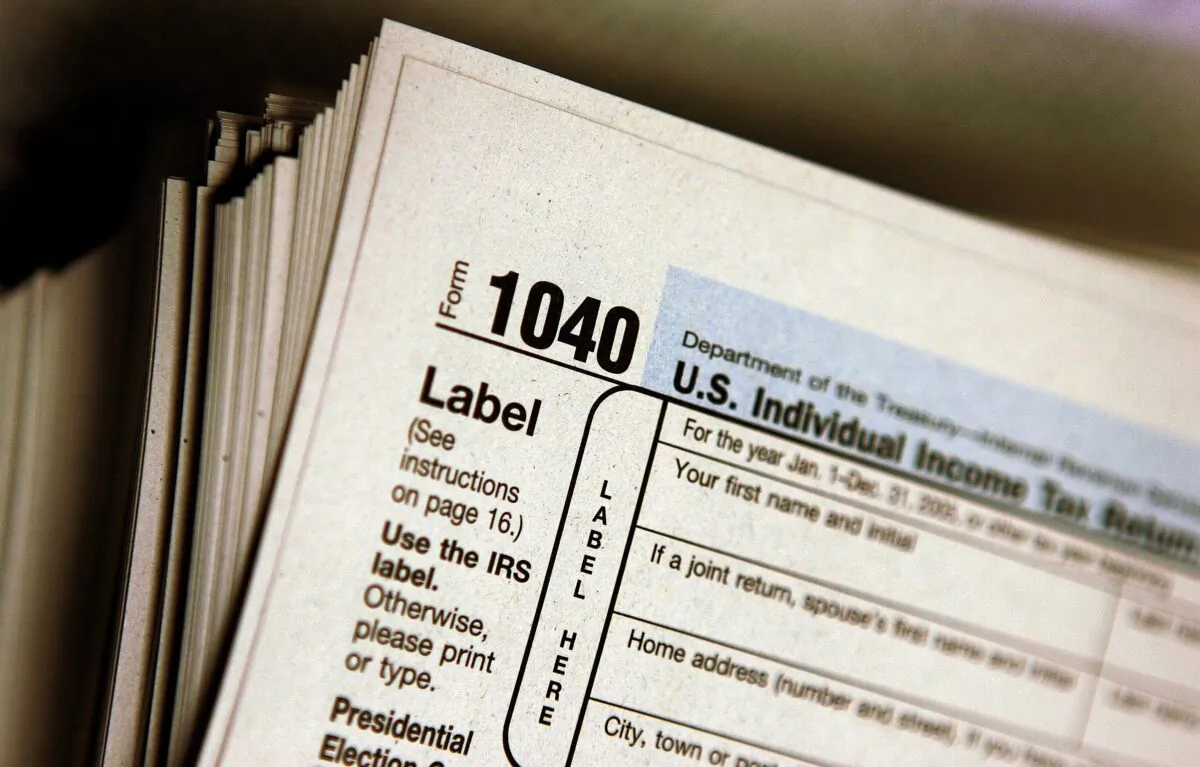 The top of a form 1040 individual income tax return is seen atop a stack on the same at the Des Plaines Public Library in Des Plaines, Ill., on March 23, 2006. (Tim Boyle/Getty Images)