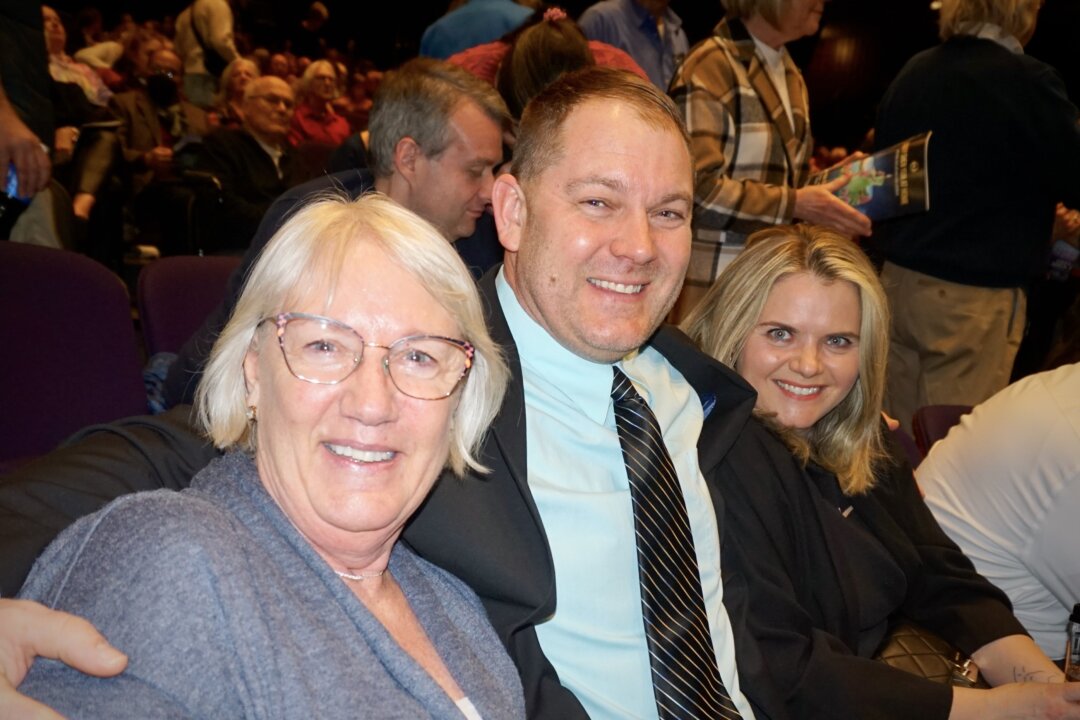 Donna Schwartz, her son Joseph Schwartz, and his girlfriend at the Shen Yun Performing Arts performance at Mary W. Sommervold Hall at Washington Pavilion, on Feb. 28, 2023. (Yawen Hung/The Epoch Times)