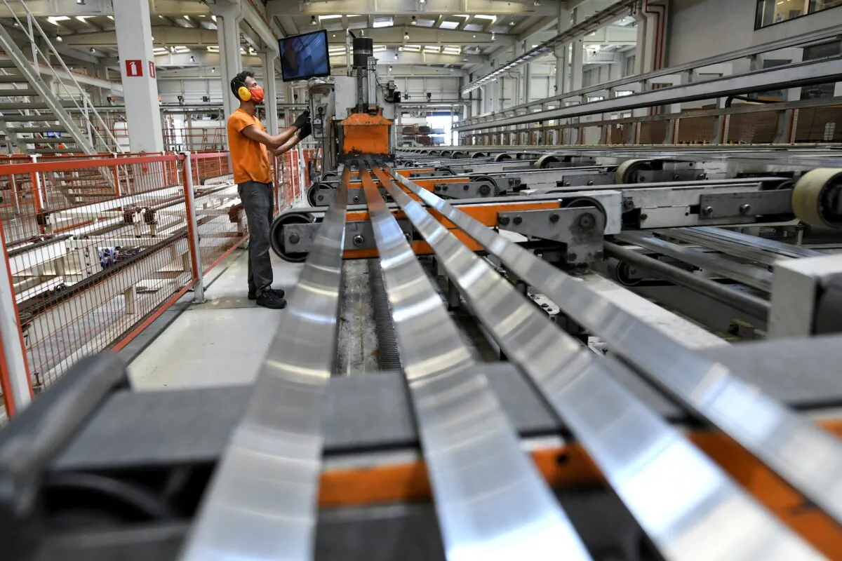 Nikos Ballas, 31, works at Cosmos Aluminium factory in Larissa, Greece, on July 8, 2021. (Alexandros Avramidis/Reuters)