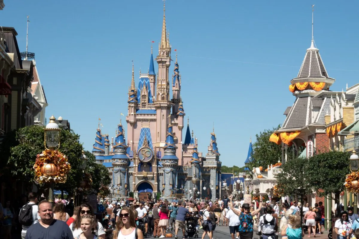Visitors walk along Main Street at The Magic Kingdom of Walt Disney World in Orlando, Fla., on Sept. 30, 2022. (Bryan R. Smith/AFP via Getty Images)