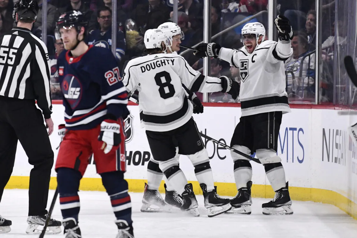 Los Angeles Kings' Anze Kopitar celebrates his goal against the Winnipeg Jets with Drew Doughty (8)
during the second period of an NHL hockey game in Winnipeg, Manitoba, on Feb. 28, 2023. (Fred Greenslade/The Canadian Press via AP)