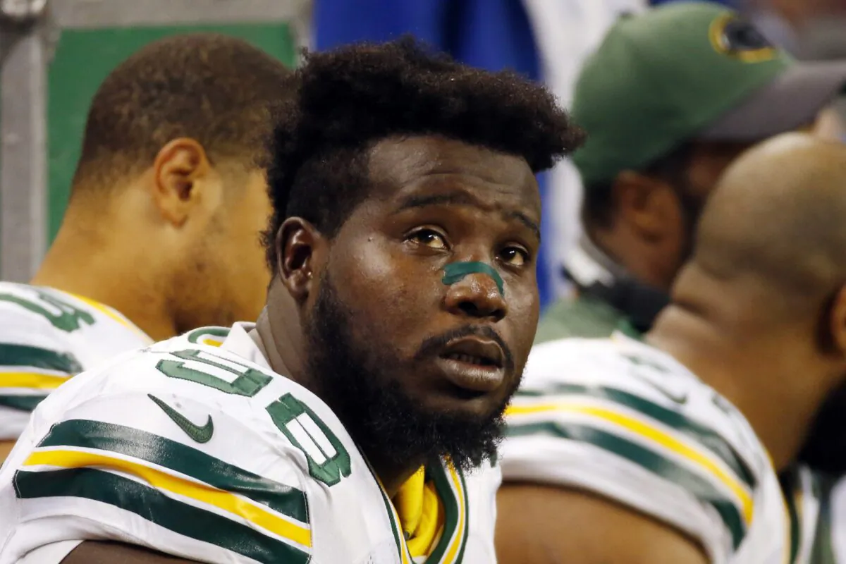 Green Bay Packers defensive tackle Letroy Guion (98) sits on the bench during the first half of an NFL football game against the Detroit Lions in Detroit on Dec. 3, 2015. (Paul Sancya/AP Photo)