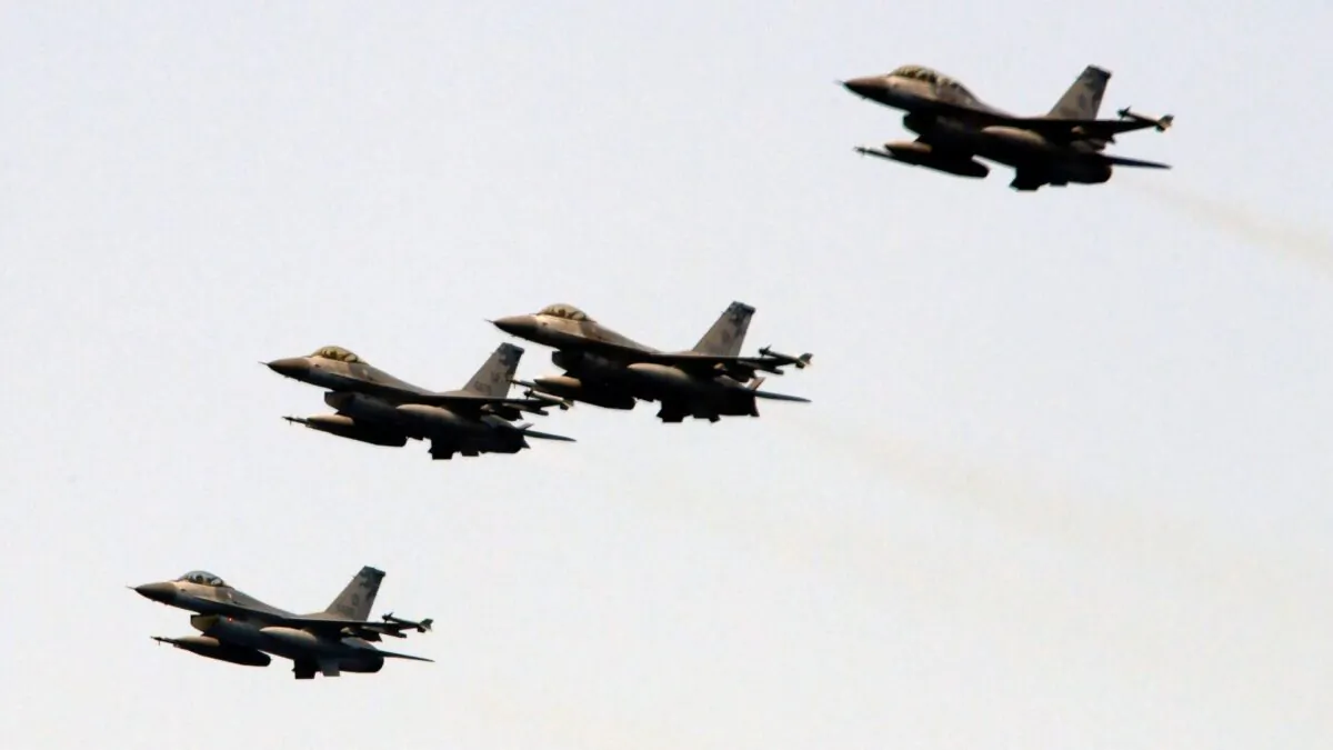 Slovak Air Force MiG-29s fly over an airport during an airshow in Malacky, Slovakia, on Aug. 27, 2022. (Petr David Josek/AP Photo)