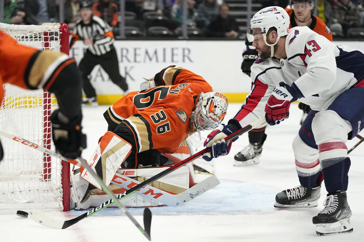 Washington Capitals right wing Tom Wilson, right, tries to get a shot past Anaheim Ducks goaltender John Gibson during the second period of an NHL hockey game in Anaheim, Calif., Mar. 1, 2023. (Mark J. Terrill/AP Photo)