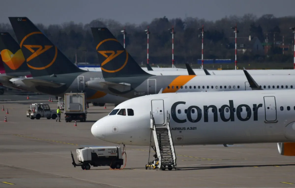 Airplanes of the leisure airline Condor are parked on the tarmac at the airport of Duesseldorf, western Germany, on March 25, 2020. (Ina Fassbender/AFP via Getty Images)
