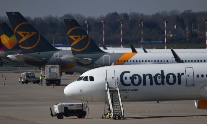 A plane of the leisure airline Condor parked on the tarmac at Düsseldorf Airport in western Germany, March 25, 2020.  (Ina Fassbender/AFP via Getty Images)