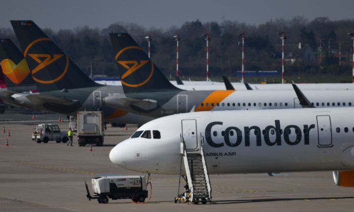 Airplanes of the leisure airline Condor are parked on the tarmac at the airport of Duesseldorf, western Germany, on March 25, 2020. (Ina Fassbender/AFP via Getty Images)