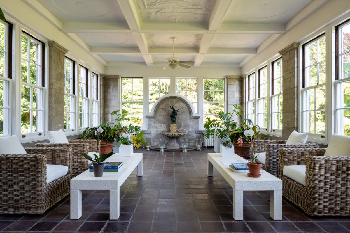 This casual gathering area of the main residence features huge windows to let in the light and afford an unobstructed view of the grounds. (Daniel Milstein for Sotheby’s International Realty)