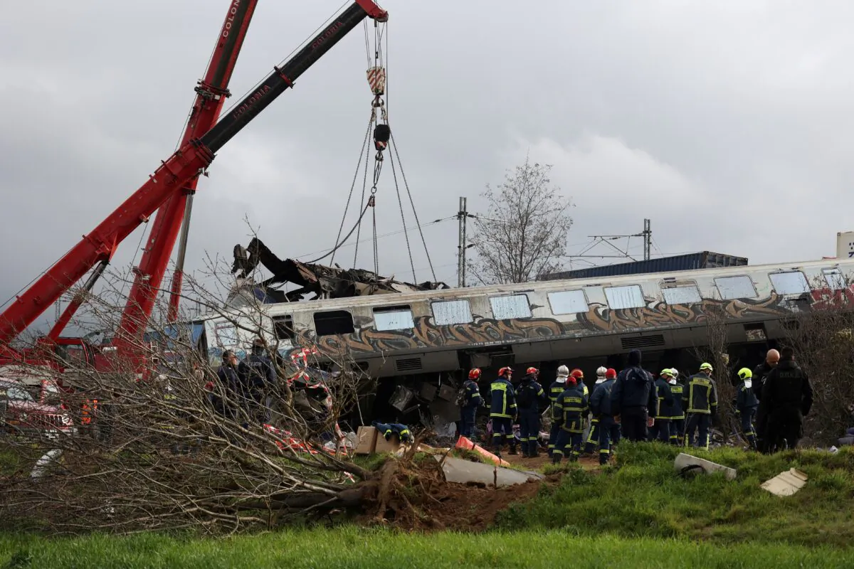 Rescuers operate at the site of a crash, where two trains collided, near the city of Larissa, Greece, on March 1, 2023. (Alexandros Avramidis/Reuters)