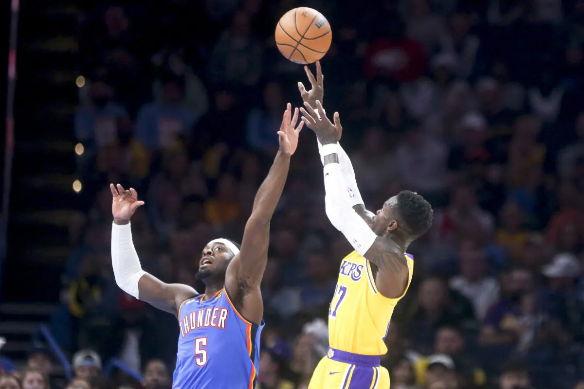 Dennis Schroder (17) of the Los Angeles Lakers shoots over Luguentz Dort (5) of the Oklahoma City Thunder during the fourth quarter at Paycom Center in Oklahoma City on Mar. 1, 2023. (Ian Maule/Getty Images)