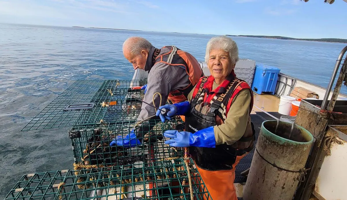 Carlton Joyce (L) and Pacita Joyce (R), parents of Maine lobsterman Jason Joyce haul in lobster traps on Joyce's boat. (Courtesy of Jason Joyce)