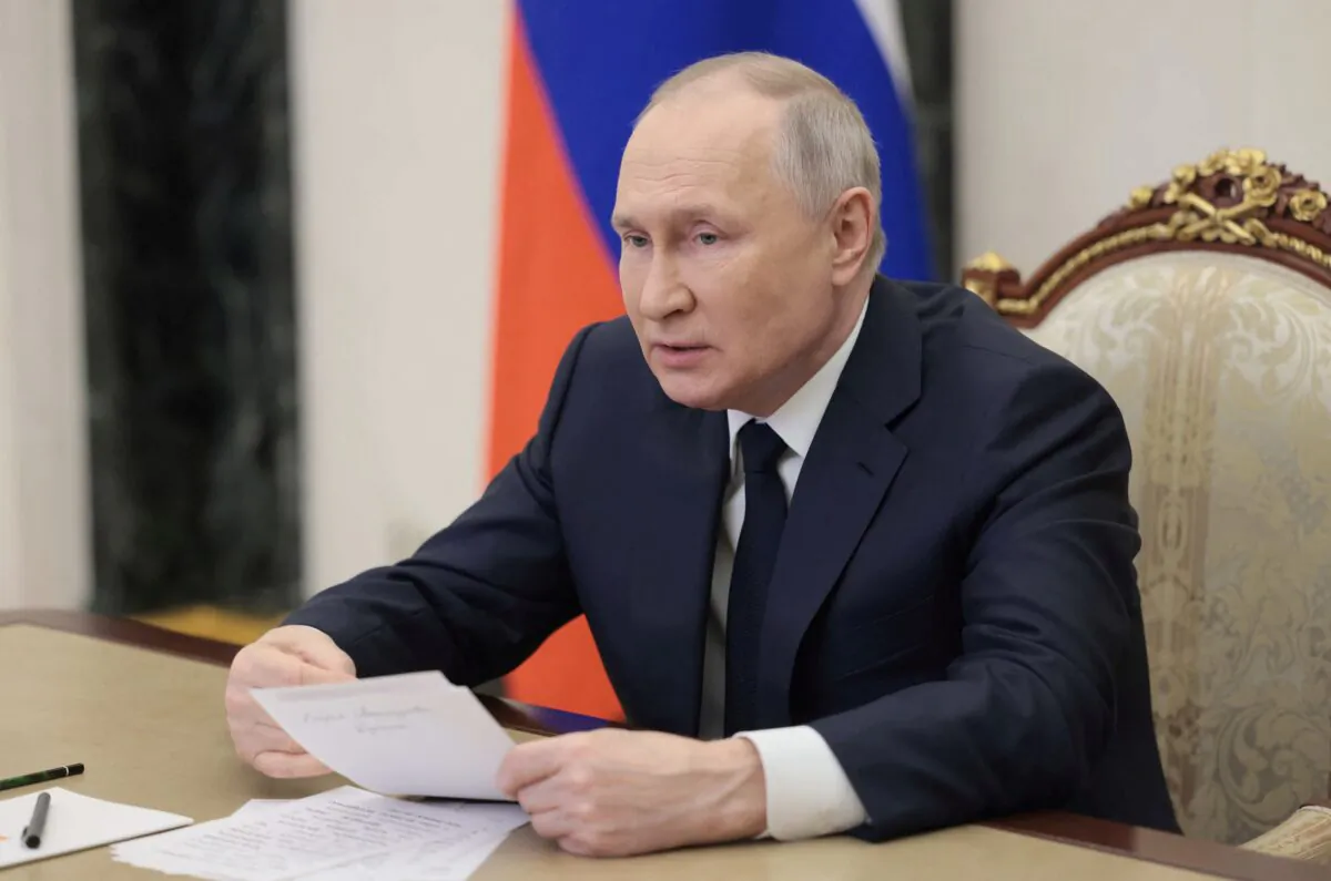 Russian President Vladimir Putin takes part in the opening ceremony of the Year of Teacher and Mentor via video link in Moscow on March 2, 2023. (Sputnik/Mikhail Metzel/Pool via Reuters)