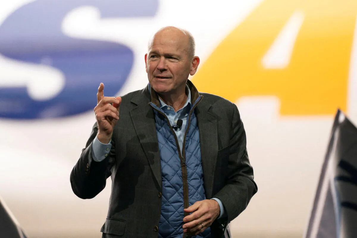 Dave Calhoun, CEO of Boeing, speaks on stage during the delivery of the final 747 jet at their plant in Everett, Wash., on Jan. 31, 2023. (David Ryder/Reuters)