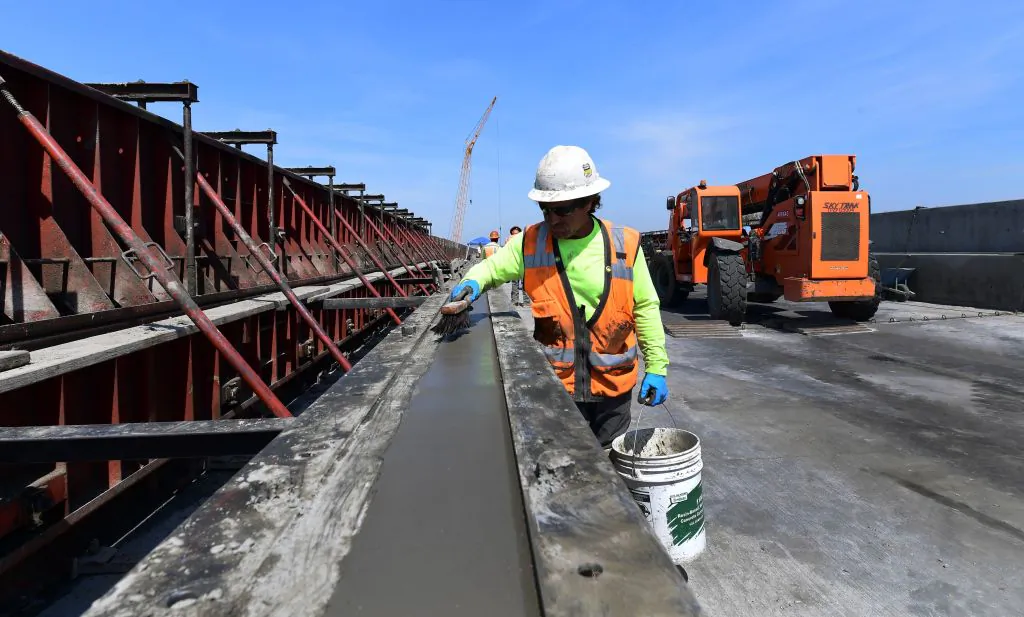 Cement is laid on the San Joaquin River viaduct portion of the high-speed rail line being built in Fresno, Calif., on May 8, 2019, amid ongoing construction of the railway in the state's Central and San Joaquin Valleys. (Frederic J. Brown/AFP via Getty Images)