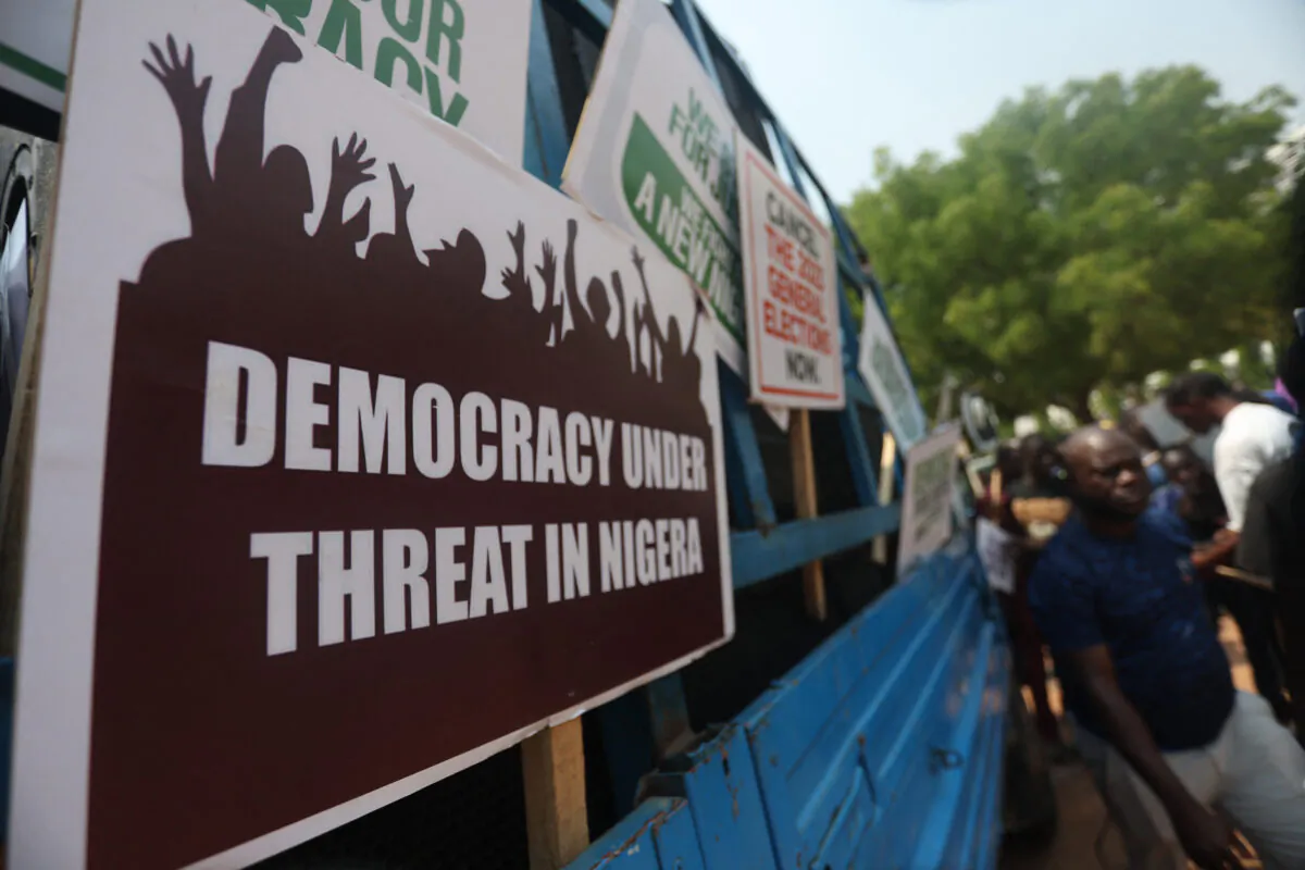 Placards are displayed on a vehicle as a group of people protest the outcome of the 2023 presidential elections and the emergence of the candidate of All Progressives Congress' (APC) Bola Tinubu as the president-elect in Abuja, Nigeria, on March 1, 2023. (Kola Sulaiman/ AFP via Getty Images)
